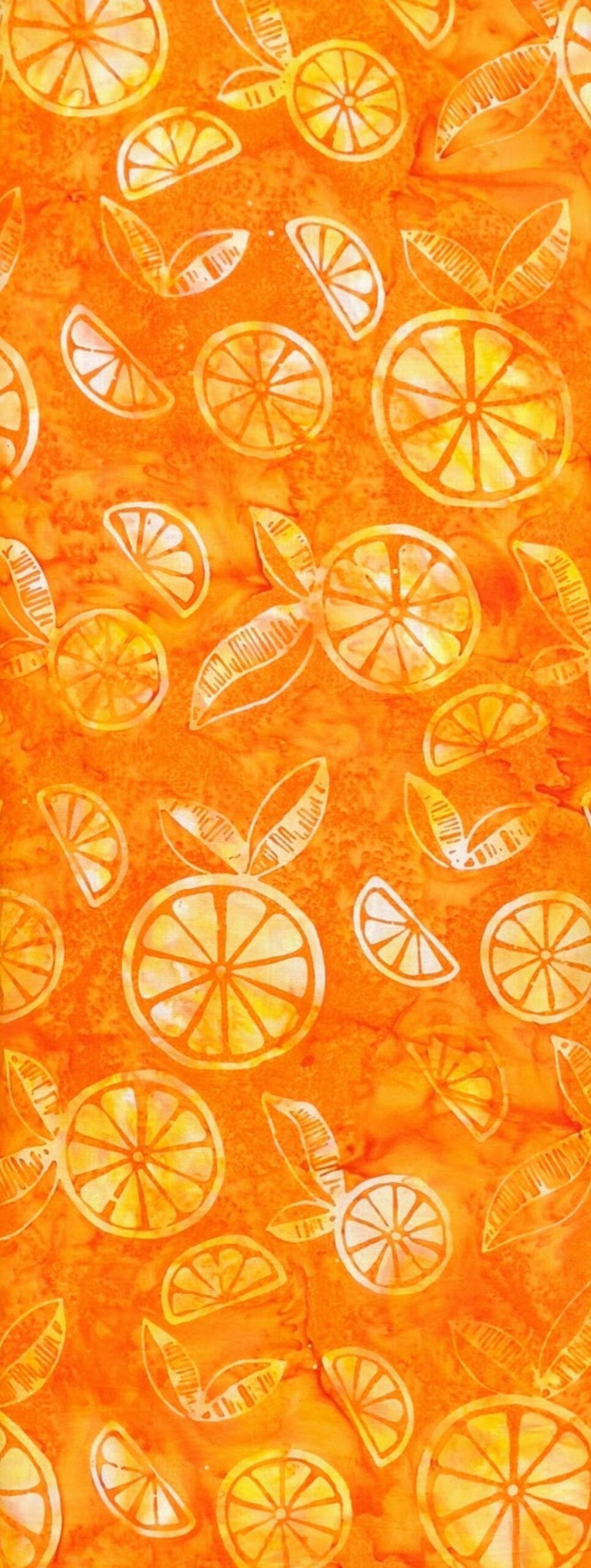 Pattern of oranges and orange slices on an orange background